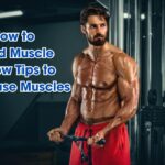 Muscular man in red shorts using a cable machine at the gym. Text: "How to Build Muscle: Know Tips to Increase Muscles