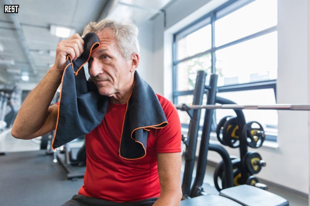 A man resting after exercise at the gym 